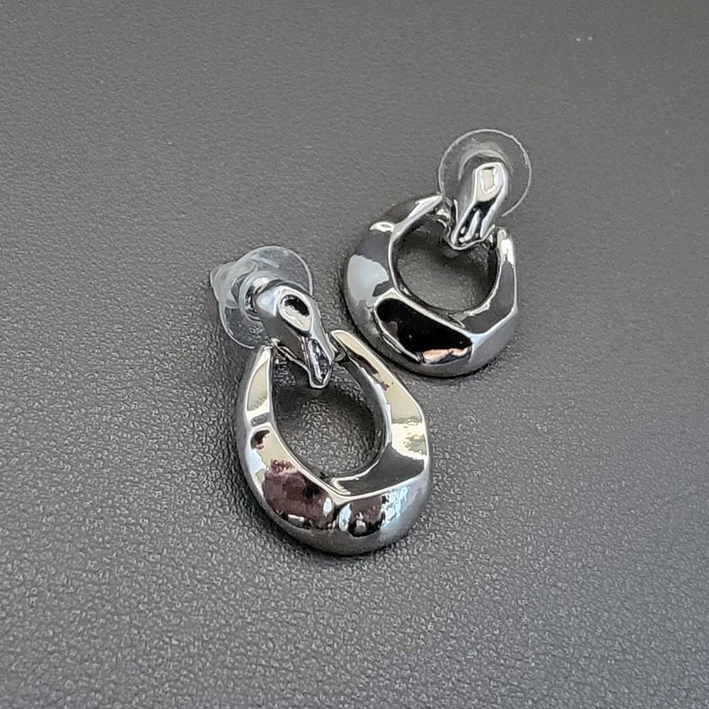 Molten Modernist Doorknocker Earrings | Sculptural Silver Statement